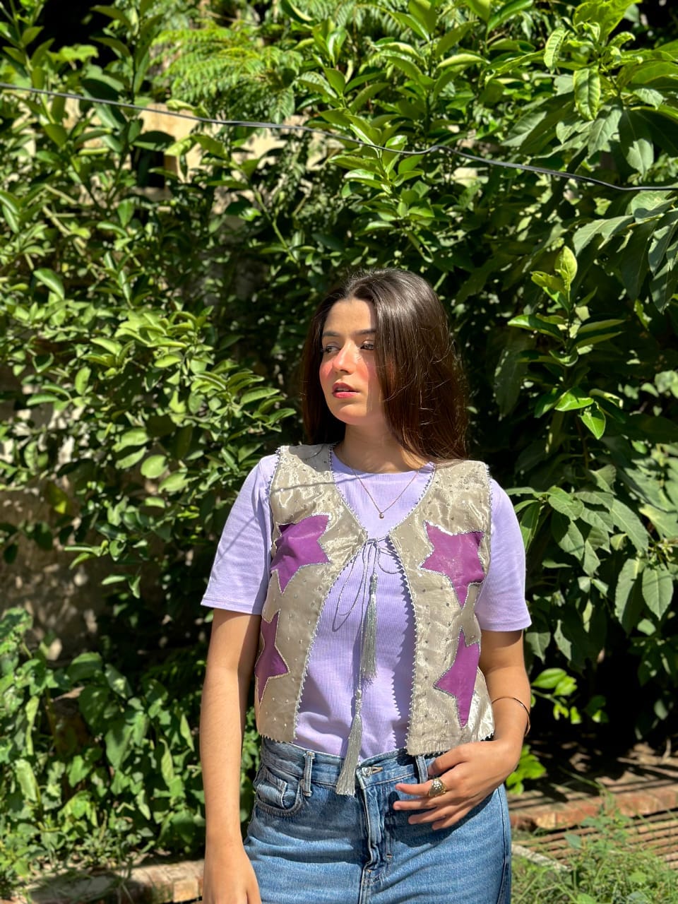 Lavender star appliqué tie-front vest styled over a lavender T-shirt