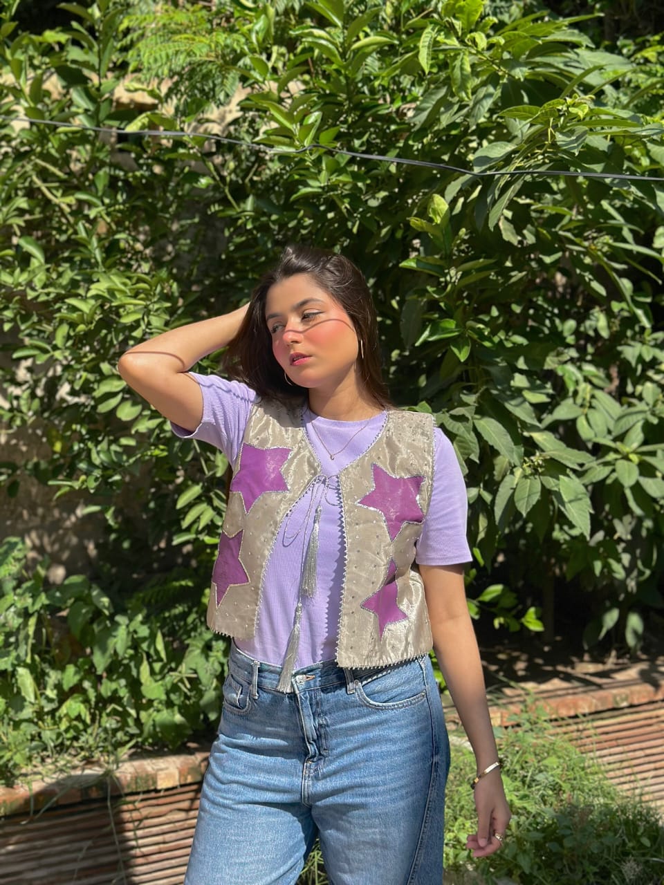 Lavender star vest styled with blue jeans